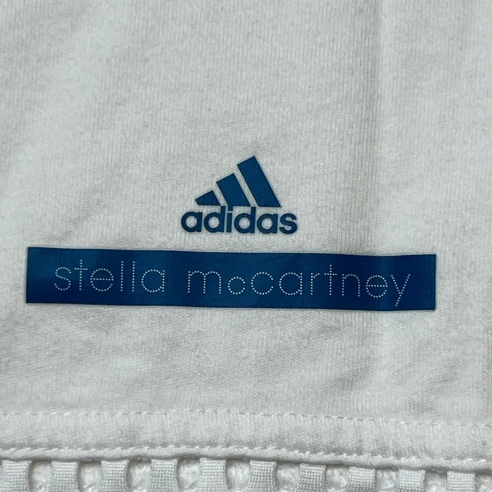 White adidas work out active shirt with mesh on the top and bottom. - Picture 6 of 8
